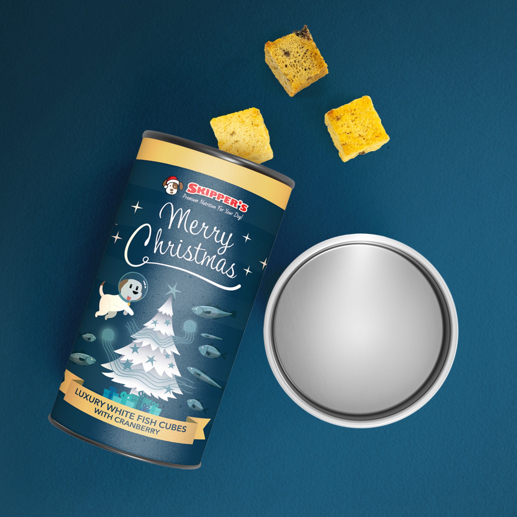 Skipper's Christmas pet food can with fish cubes on a blue background