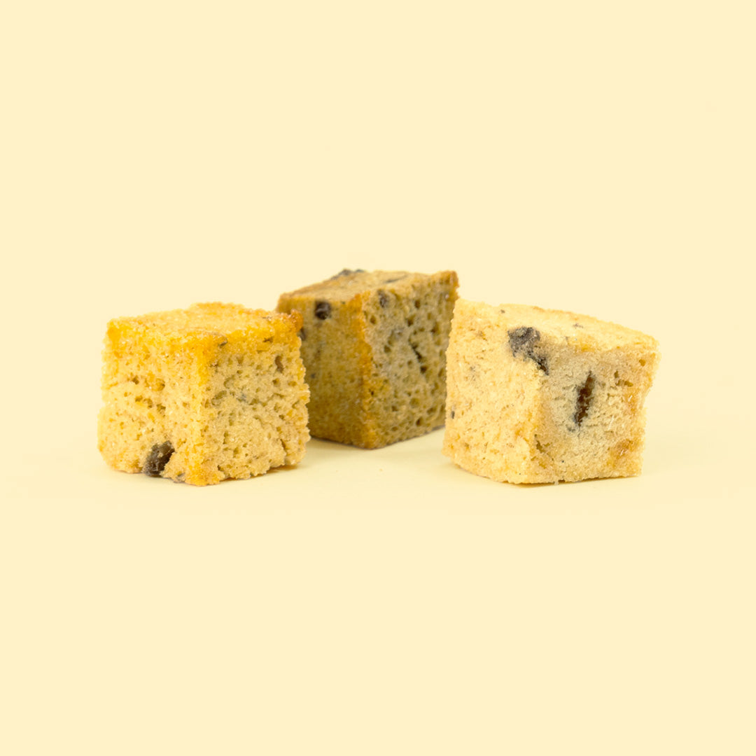 Two Luxury Whiteifsh Cubes Skipper's Dog Treats on a Yellow Background
