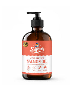 A 250ml bottle of Skipper's Cold Pressed Salmon Oil for dogs and cats, featuring an amber glass bottle with a black pump dispenser and a coral and white label.